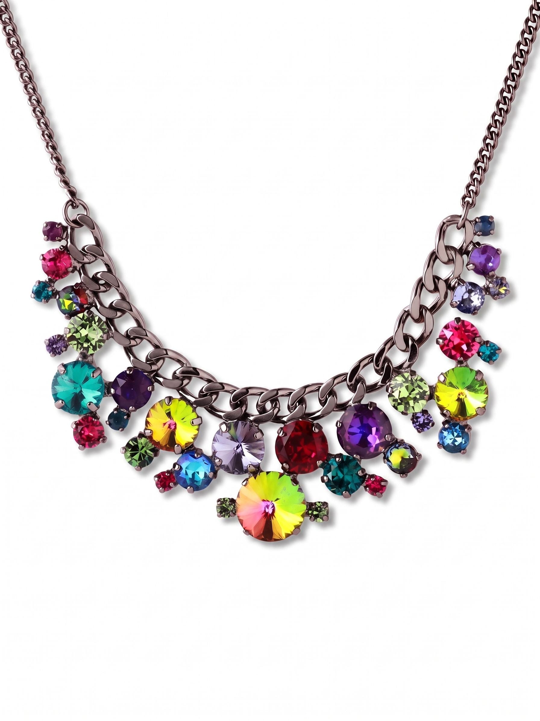Poppy Statement Necklace - NGL1GMNNI - <p>A thick gunmetal curb chain provides a substantial foundation for a dense, vibrant cluster of multicolored crystals. Deep jewel tones like blue zircon, rich burgundy, and shifting crystal volcano create a saturated sweep of color across the collarbone. The weight of the chain keeps the asymmetrical crystal arrangement anchored and resting naturally against the chest, preventing unwanted twisting as you move. With its adjustable length, you can easily shift the placement to frame the neckline of a tailored blazer or sit boldly over a dark knit sweater.</p><ul>
<li>Substantial curb chain anchoring an asymmetrical cluster of round-cut crystals</li>
<li>Dense bib silhouette designed to rest comfortably across the collarbone</li>
<li>Lobster claw clasp</li>
<li>4-inch adjustable extension chain</li>
<li>Includes organza pouch for gifting and travel</li>
</ul>