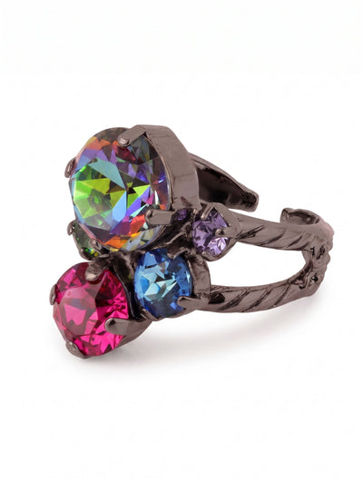 Crystal Assorted Rounds Cocktail Ring - RDB11GMNNI - <p>A textured dark metal band splits to create the illusion of a carefully curated stack. It holds an asymmetrical cluster of vibrant round-cut crystals, anchored by an oversized iridescent center stone that flashes with deep pinks, vivid blues, and greens as your hand moves. The dark setting provides a sharp contrast that makes the colors pop. An open back allows you to gently adjust the sizing for a comfortable custom fit that adapts entirely to you.</p><ul>
<li>Asymmetrical cluster of mixed-scale round crystals set on a textured split band</li>
<li>Illusion of a layered stack with the secure stability of a single piece</li>
<li>Adjustable ring band</li>
<li>Includes signature organza pouch for gifting and travel</li>
</ul>