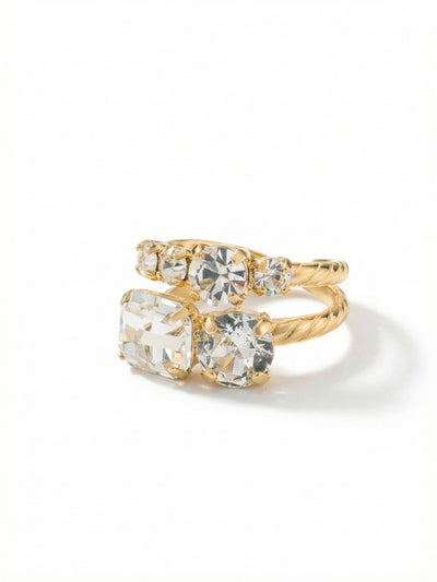 Miriam Stacked Ring - RFC44BGCRY - <p>The Miriam Stacked Ring creates the look of a carefully curated collection in one distinct piece. A prominent emerald-cut clear crystal grounds the arrangement, balanced by a descending rhythm of round cuts that shift and catch the light as you talk with your hands. The twisted rope texture of the band adds tactile interest, while the open design gently adjusts to your finger. It offers substantial presence without feeling heavy, easily transitioning from morning meetings to evening dinners.</p><ul>
<li>Asymmetric arrangement of emerald and round cuts creates varied light refraction</li>
<li>Twisted metal band adds a tactile element to the stacked silhouette</li>
<li>Adjustable ring band</li>
<li>Protective e-coat finish for lasting wear</li>
<li>Includes signature organza pouch for gifting and travel</li>
</ul>