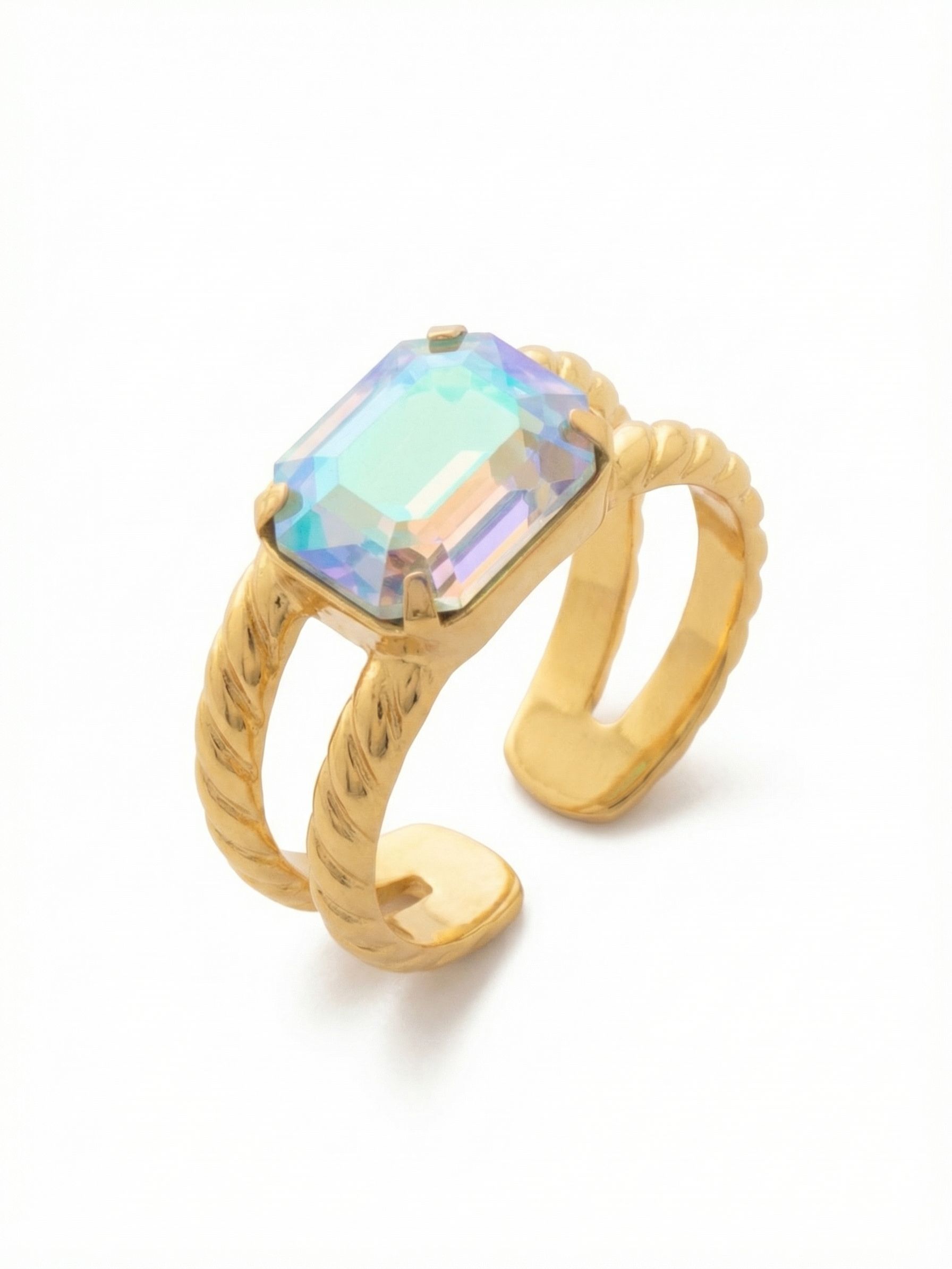 Octavia Adjustable Cocktail Ring - RFK6BGAQA - <p>A single emerald-cut crystal anchors this structured cocktail ring, catching the light with a shifting, iridescent aquamarine finish as you move your hand. A split, subtly textured band frames the geometric shape, giving it a slightly suspended effect. An open back allows you to easily adjust the sizing to wear it on different fingers throughout the week.</p><ul>
<li>Split textured band creates an architectural profile on the hand</li>
<li>Solitaire emerald-cut crystal offers clean geometric lines and shifting iridescent color</li>
<li>Adjustable ring band</li>
<li>Protective e-coat finish for lasting wear</li>
<li>Includes signature organza pouch for gifting and travel</li>
</ul>