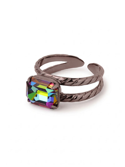 Octavia Adjustable Cocktail Ring - RFK6GMVO - <p>A single emerald-cut crystal sits horizontally across the finger, catching light in intense flashes of green, gold, and violet. The dark gunmetal setting grounds the bold colors while a textured split band keeps the profile sleek. Built with an open back, the ring adjusts easily to fit different fingers as your daily styling changes.</p><ul>
<li>East-west oriented emerald cut spans the finger</li>
<li>Textured split band adds visual lightness to the ring profile</li>
<li>Adjustable ring band</li>
<li>Includes organza pouch for gifting and travel</li>
</ul>