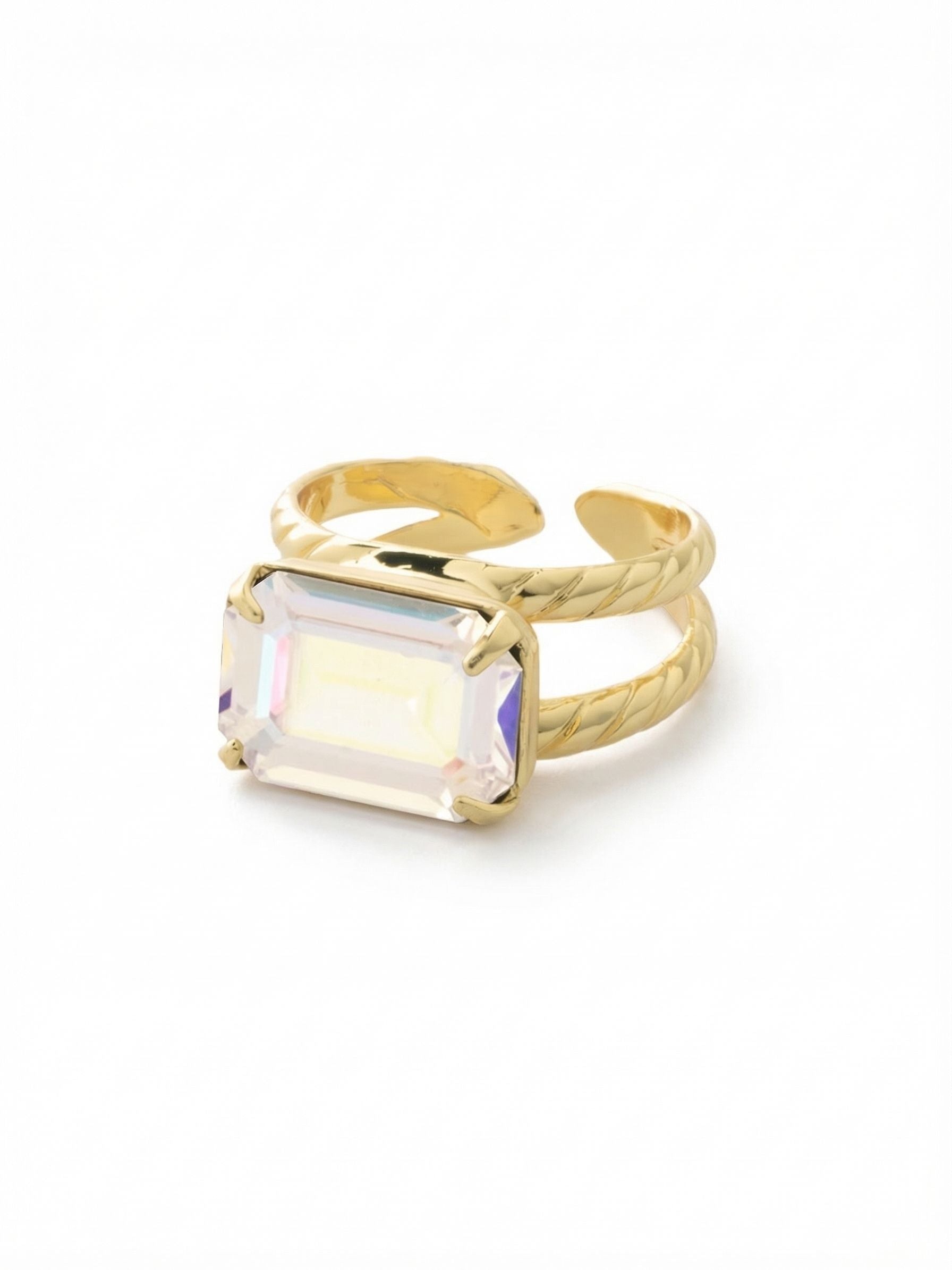 Emerald Cocktail Ring - RFL88BGCAB - <p>A single emerald-cut crystal anchors this cocktail ring, catching light and shifting in color with every movement of your hand. The iridescent stone sits securely within a split band detailed with a subtle rope texture. Because the back of the bright gold-tone setting remains open, you can gently adjust the fit to wear it on whichever finger you choose. It offers substantial volume and presence while remaining comfortable enough for daily wear.</p><ul>
<li>Prominent emerald-cut crystal emphasizes clean geometric lines</li>
<li>Split band design framed by a delicate twisted rope texture</li>
<li>Adjustable ring band</li>
<li>Protective e-coat finish for lasting wear</li>
<li>Includes signature organza pouch for gifting and travel</li>
</ul>