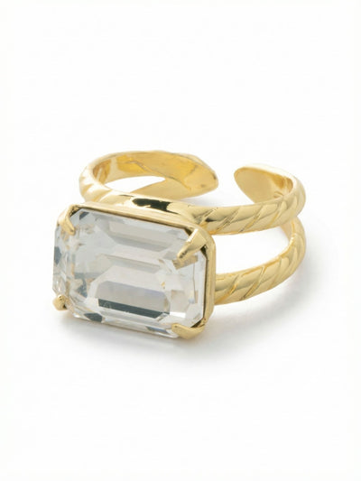 Emerald Cocktail Ring - RFL88BGCRY - <p>A single emerald-cut clear crystal spans the finger horizontally in a crisp east-west alignment. The architectural lines of the step-cut stone catch the light with structured clarity rather than overwhelming sparkle. Held securely by four prongs, the centerpiece is anchored on a textured split-shank band. The open-back design allows you to gently adjust the size, making it easy to shift the ring between different fingers or accommodate slight changes in fit as you move through your day.</p><ul>
<li>Crisp east-west orientation of the focal step-cut stone</li>
<li>Textured split-shank band adds subtle metallic dimension</li>
<li>Adjustable ring band</li>
<li>Protective e-coat finish for lasting wear</li>
<li>Includes signature organza pouch for gifting and travel</li>
</ul>
