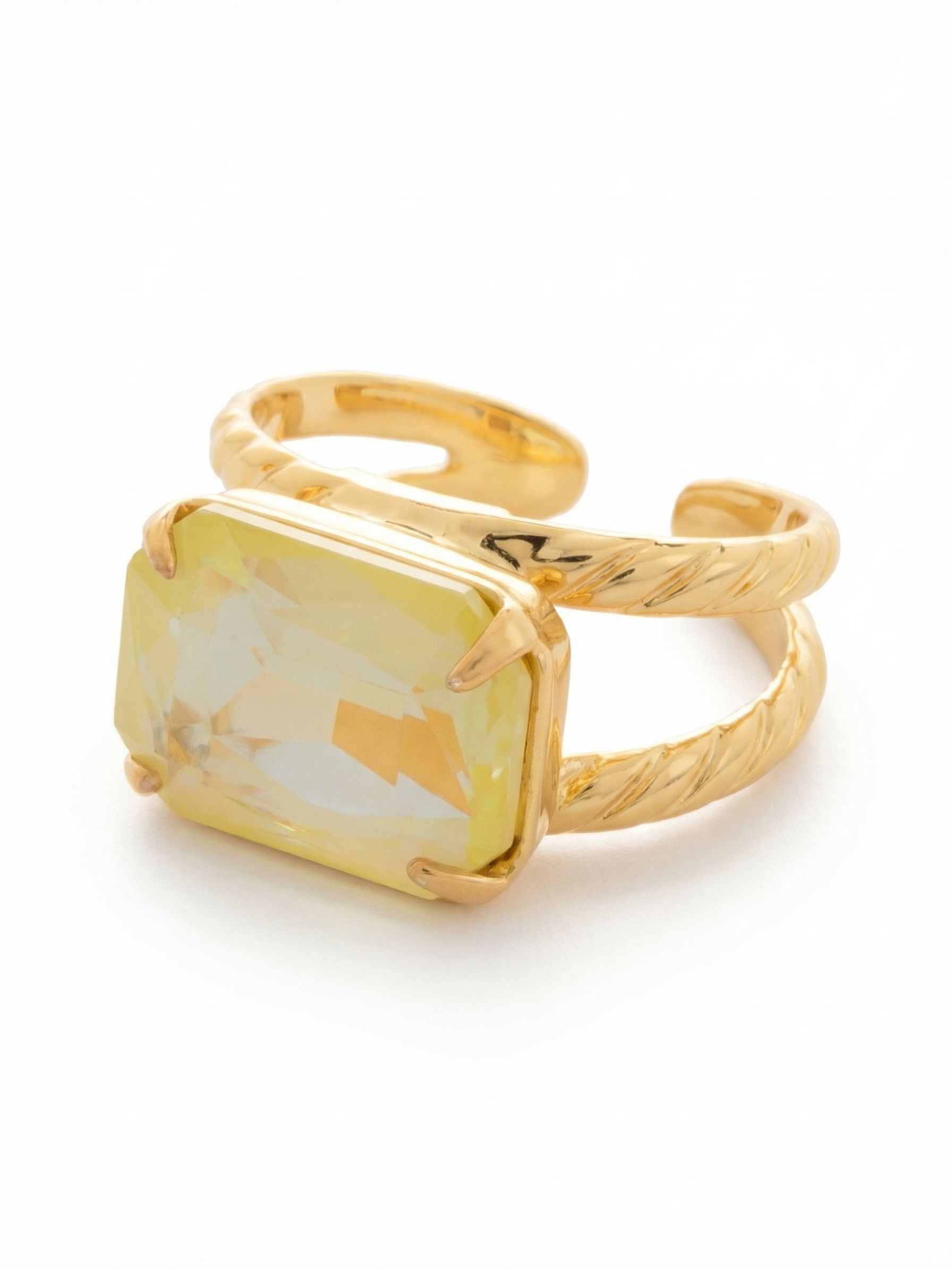 Emerald Cocktail Ring - RFL88BGLTD - <p>A single, substantial emerald-cut crystal spans the finger in an east-west orientation, catching and throwing light with every gesture. The split, twisted-rope band gives the piece a grounded presence on the hand while maintaining a comfortable, open feel. An open-back design allows you to adjust the fit, making it easy to shift between fingers depending on your mood or the rings you pair it with. This is an effortless anchor piece for daily wear.</p><ul>
<li>East-west stone setting creates a bold horizontal presence</li>
<li>Split double band with detailed twisted rope texture</li>
<li>Adjustable ring band</li>
<li>Protective e-coat finish for lasting wear</li>
<li>Includes signature organza pouch for gifting and travel</li>
</ul>