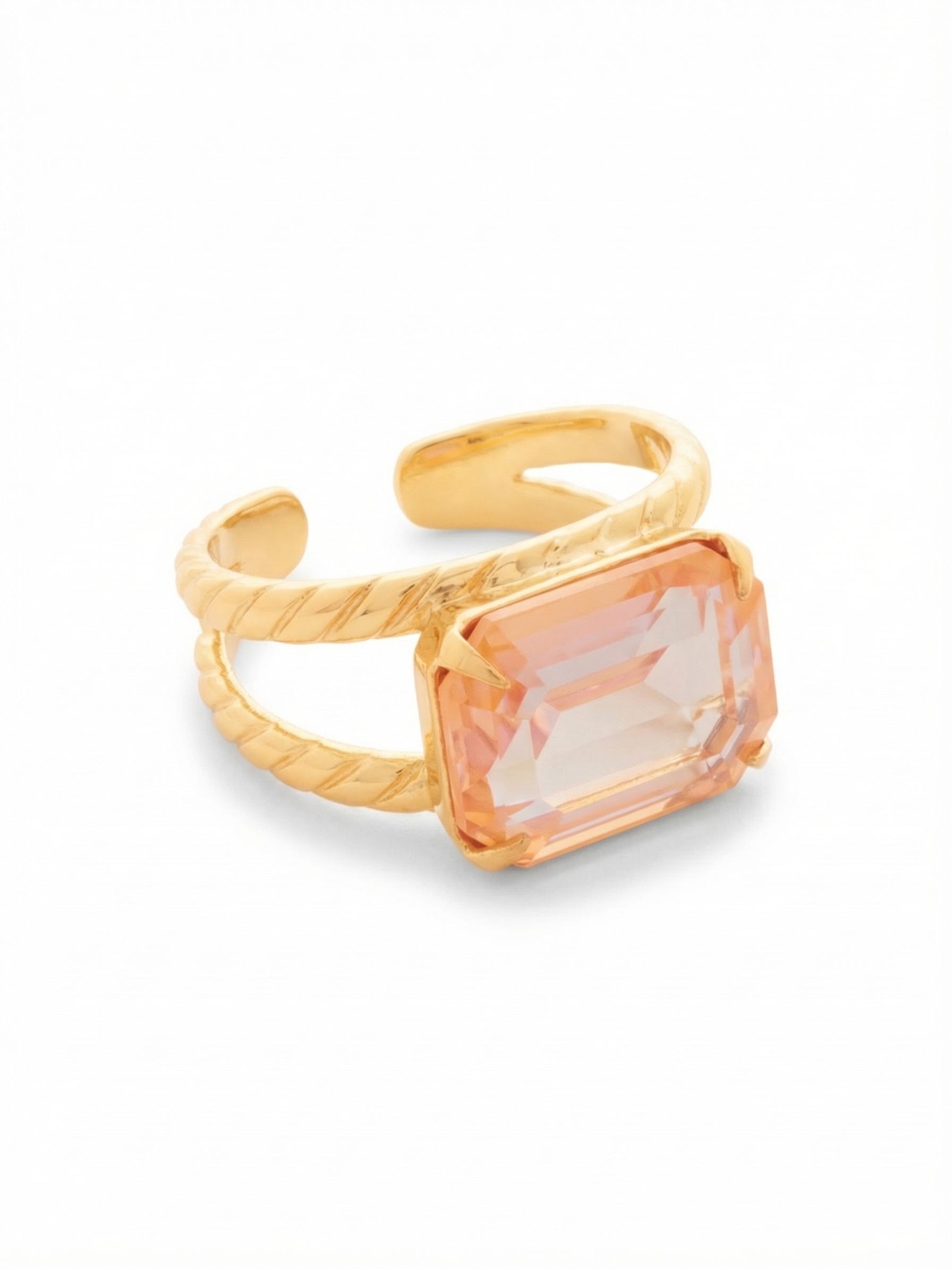 Emerald Cocktail Ring - RFL88BGPD - <p>Clean geometric lines meet a warm, glowing hue. A single emerald-cut crystal anchors this ring, catching light through broad, architectural facets. It sits horizontally across a split, rope-textured band that provides a substantial feel while remaining entirely comfortable on the hand. The open back design allows you to gently squeeze or widen the band, so you can easily move it from one finger to another depending on the day.</p><ul>
<li>Horizontally set emerald-cut crystal centerpiece</li>
<li>Split band with a subtle twisted texture</li>
<li>Adjustable ring band</li>
<li>Protective e-coat finish for lasting wear</li>
<li>Includes signature organza pouch for gifting and travel</li>
</ul>
