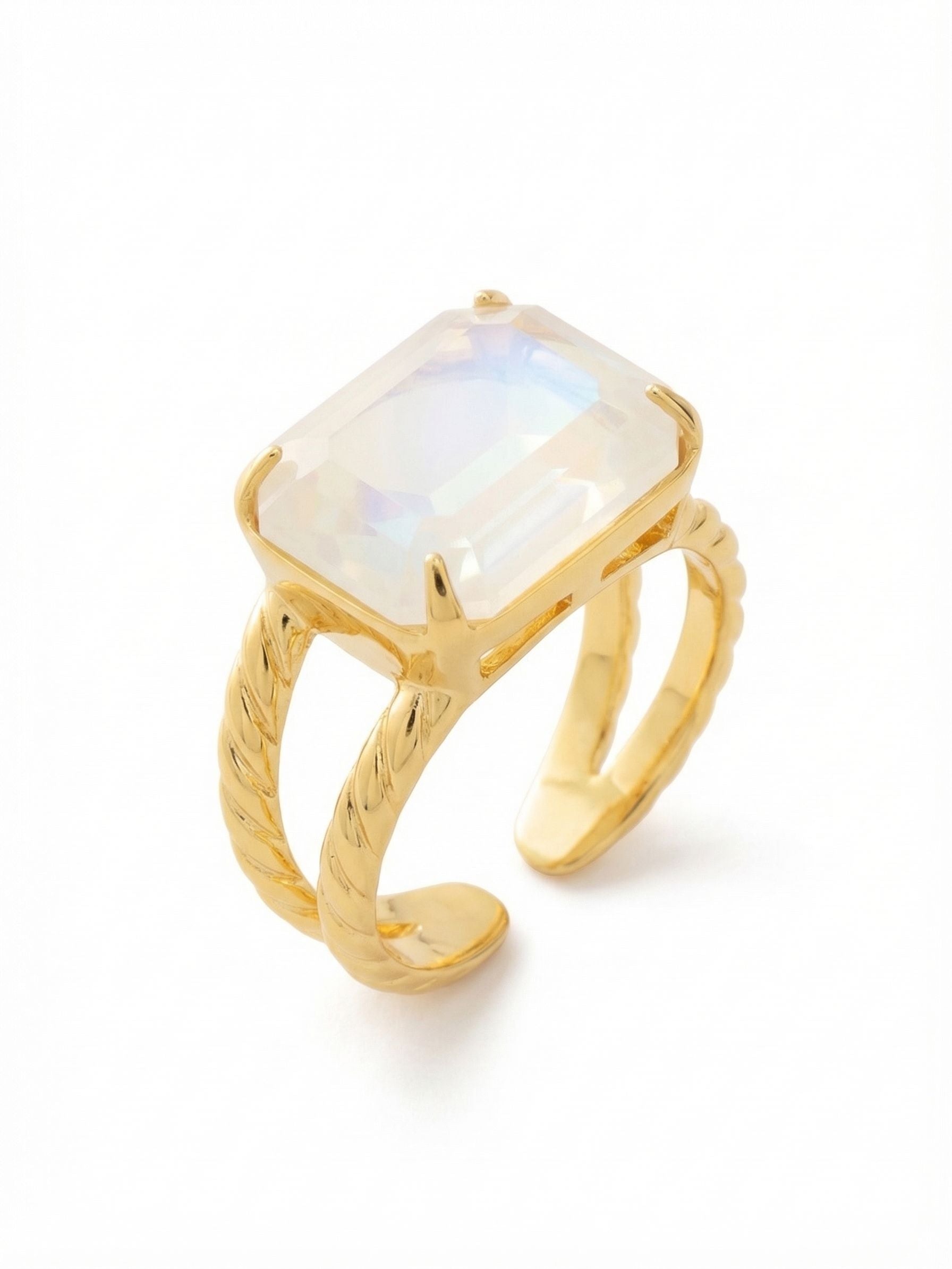 Emerald Cocktail Ring - RFL88BGUWAB - <p>A single emerald-cut crystal spans horizontally across the finger, anchored by a substantial double band. The setting uses a twisted texture to frame the stone, adding dimension to the clean geometric lines. The open back allows for a custom fit that adapts to your hand, remaining comfortable as your day shifts. It carries a solid, grounded weight that feels intentional every time you reach for a coffee cup or rest your hand on a keyboard.</p><ul>
<li>Horizontally set emerald-cut crystal for an elongated profile</li>
<li>Double band design with a tactile twisted texture</li>
<li>Adjustable ring band</li>
<li>Protective e-coat finish for lasting wear</li>
<li>Includes signature organza pouch for gifting and travel</li>
</ul>