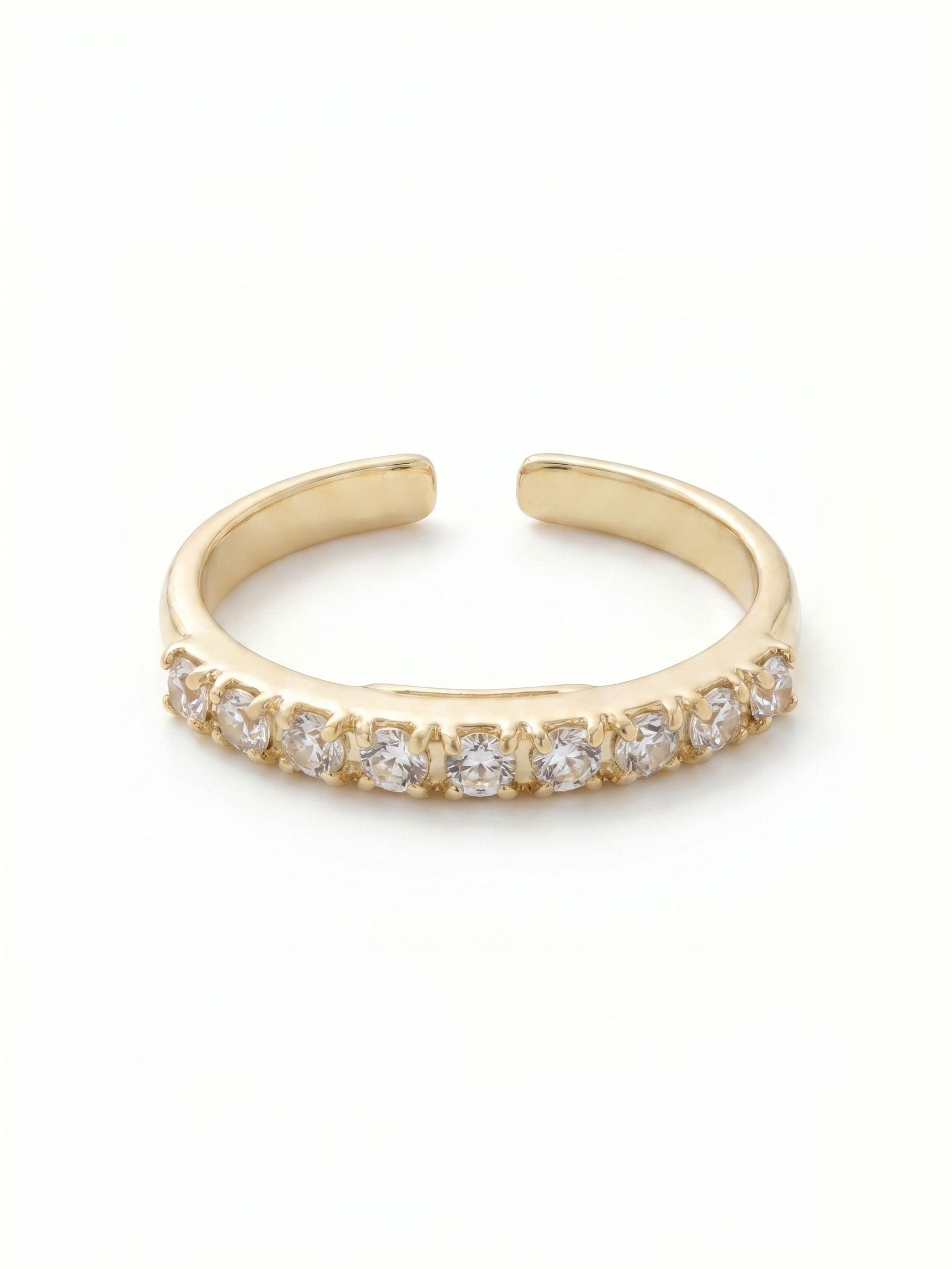 Evalina Band Ring - RFM57BGCRY - <p>A slender line of light across the hand. Built with a delicate rhinestone chain setting, this crystal band catches the light with every gesture. The open design allows for a gentle squeeze to find your exact fit, making it easy to move the ring between fingers depending on your mood. It maintains a quiet, steady presence when worn solo, or serves as a bright foundation for building a layered stack.</p><ul>
<li>Continuous row of brilliant round-cut crystals</li>
<li>Slender profile designed for effortless stacking</li>
<li>Adjustable ring band</li>
<li>Protective e-coat finish for lasting wear</li>
<li>Includes signature organza pouch for gifting and travel</li>
</ul>