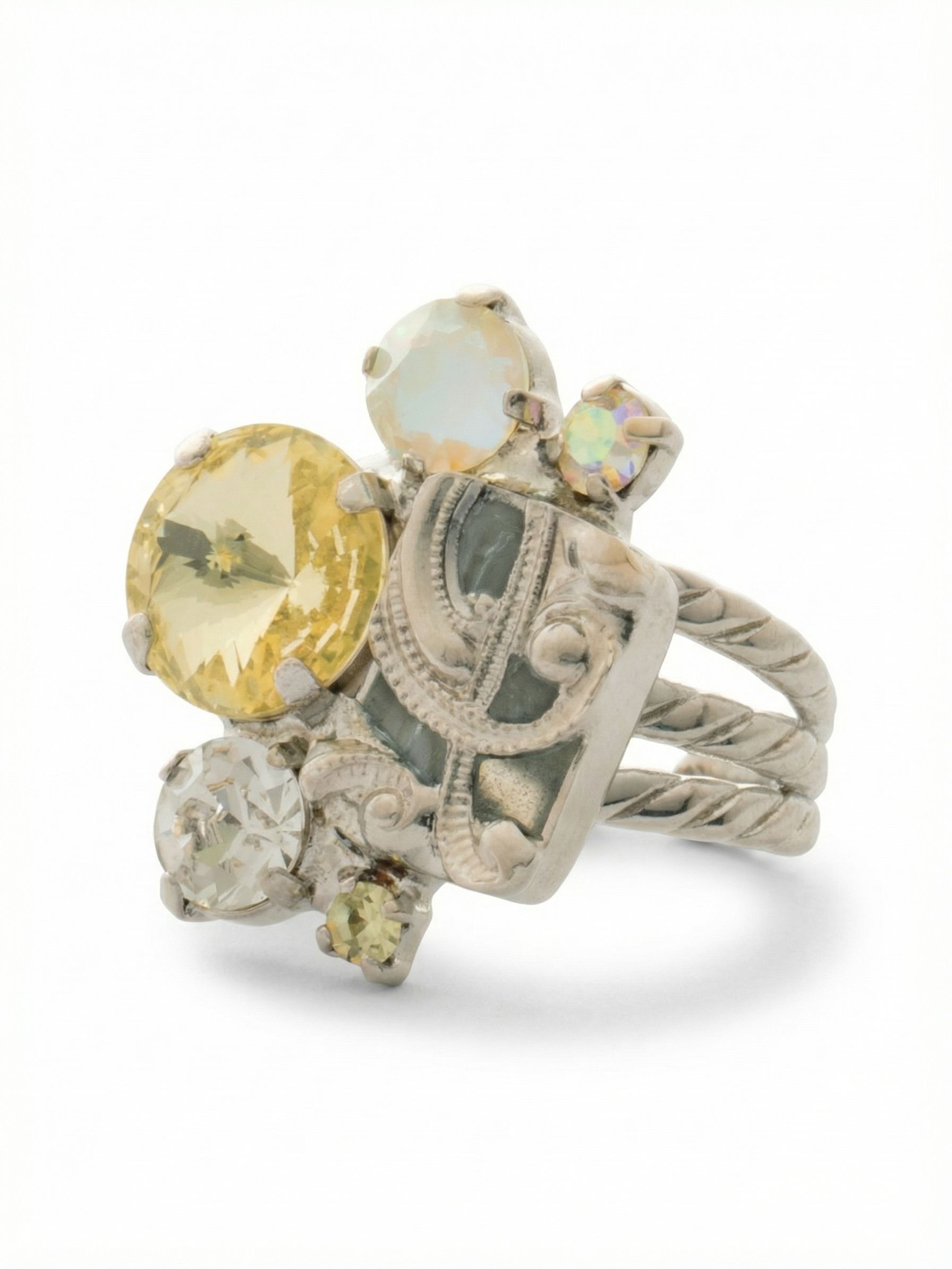 Paisley Statement Ring - RFY6PDLZ - <p>The Paisley Statement Ring features an assortment of cut crystals and a metal filigree charm on an adjustable triple stacked ring band, adjsuting to fit ring sizes 6-8.</p>