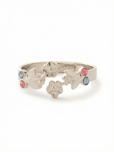 Blossom Adjustable Band Ring - RGI2PDPBZ - <p>Sculpted metal blossoms and leaves wrap around the finger in a gentle silhouette. Tiny rose and light sapphire crystals sit nestled among the botanical details, bringing a subtle wash of color to the hand. The open front leaves an airy gap at the center, keeping the piece feeling lightweight and unrestrictive as you go about your day. Designed to adapt to your changing needs, the flexible band allows you to adjust the sizing to find your most comfortable fit.</p><ul>
<li>Cast metal floral motifs create a winding botanical silhouette</li>
<li>Open-front design leaves a small airy gap at the center</li>
<li>Adjustable ring band</li>
<li>Protective e-coat finish for lasting wear</li>
<li>Includes signature organza pouch for gifting and travel</li>
</ul>