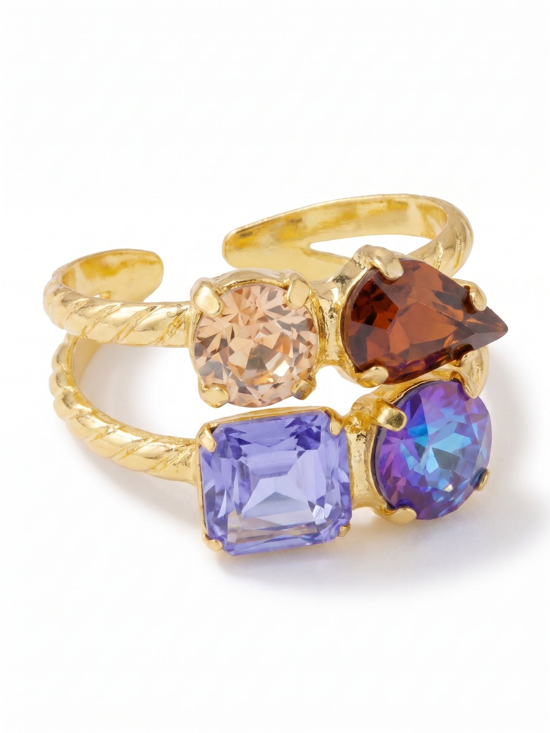 Moxie Stacked Ring - RGI3BGDNM - <p>This pre-stacked design delivers the look of two carefully curated rings with the ease of a single adjustable band. An earthy mix of rich browns and twilight blues cluster along the textured double shank, catching the light as your hands move through the day. The open back allows for a custom fit, so you can easily shift it from your index finger to your ring finger depending on your mood. It brings a grounded warmth to your daily rotation.</p><ul>
<li>Illusion of two stacked rings with contrasting crystal clusters</li>
<li>Dynamic mix of emerald, pear, and round crystal cuts</li>
<li>Adjustable ring band</li>
<li>Protective e-coat finish for lasting wear</li>
<li>Includes signature organza pouch for gifting and travel</li>
</ul>