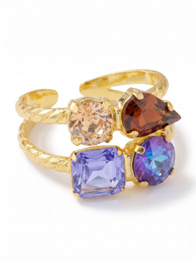 Moxie Stacked Ring - RGI3BGDNM - <p>This pre-stacked design delivers the look of two carefully curated rings with the ease of a single adjustable band. An earthy mix of rich browns and twilight blues cluster along the textured double shank, catching the light as your hands move through the day. The open back allows for a custom fit, so you can easily shift it from your index finger to your ring finger depending on your mood. It brings a grounded warmth to your daily rotation.</p><ul>
<li>Illusion of two stacked rings with contrasting crystal clusters</li>
<li>Dynamic mix of emerald, pear, and round crystal cuts</li>
<li>Adjustable ring band</li>
<li>Protective e-coat finish for lasting wear</li>
<li>Includes signature organza pouch for gifting and travel</li>
</ul>