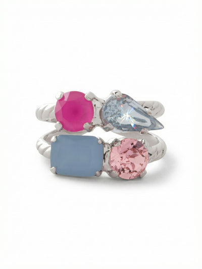 Moxie Stacked Ring - RGI3PDPBZ - <p>Four distinct stones bridge the gap between structure and play on the hand. Pear, emerald, and round cuts cluster in a built-in stack, mixing vivid pink lacquer and opaque blue opal with translucent washes of sapphire and rose. Set on a double-tiered twisted metal band, it reads as a carefully curated arrangement in one easy motion. The adjustable open back ensures a comfortable, secure fit on any finger as you move through your day.</p><ul>
<li>Double-tiered twisted rope band creates the illusion of two nested rings</li>
<li>Dynamic combination of translucent crystals and vivid opaque stones</li>
<li>Adjustable ring band</li>
<li>Protective e-coat finish for lasting wear</li>
<li>Includes signature organza pouch for gifting and travel</li>
</ul>