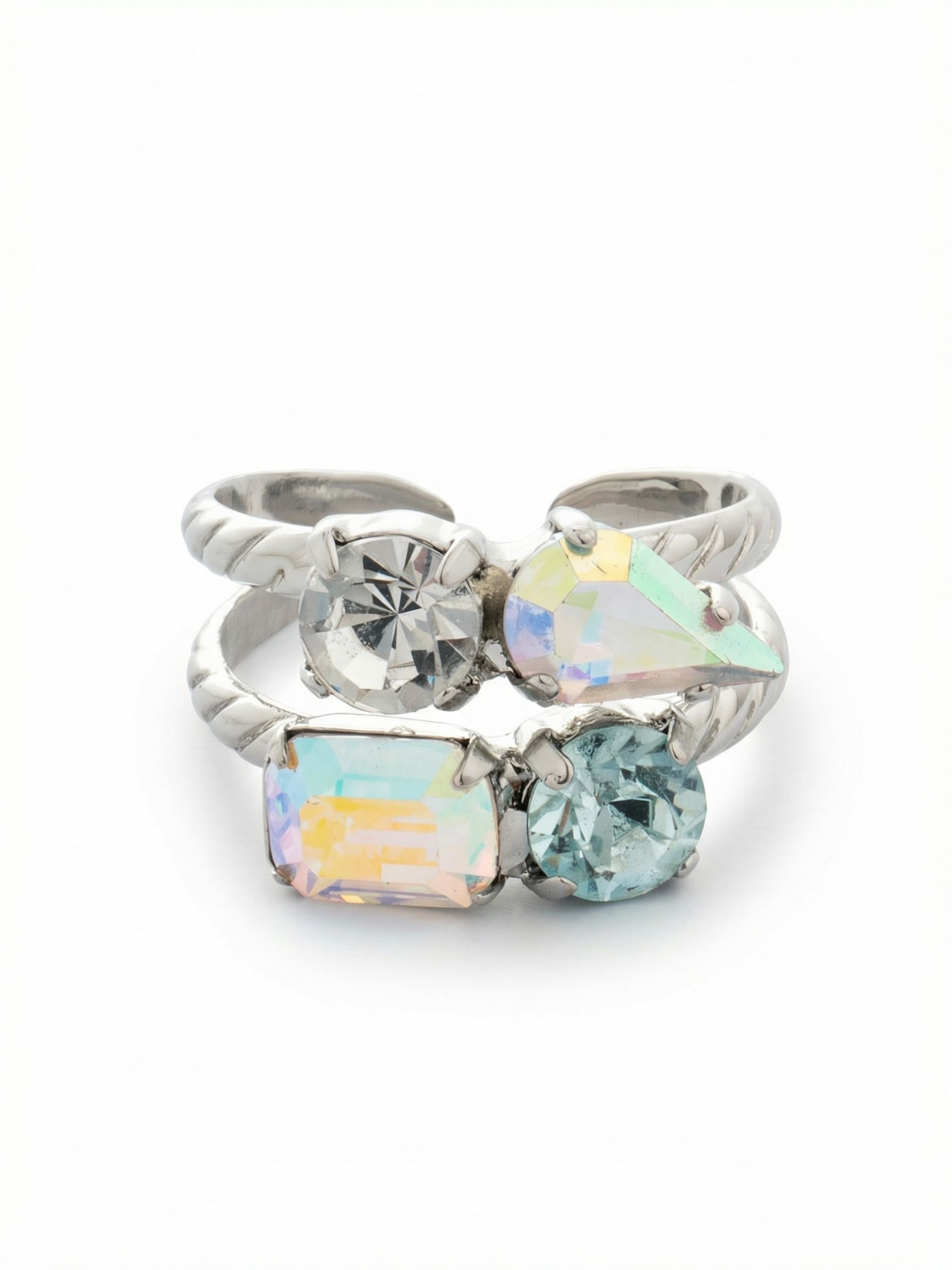 Moxie Stacked Ring - RGI3PDRQ - <p>Enjoy the visual weight of a curated stack in a single, comfortable piece. Two textured palladium bands present a deliberate mismatch of crystal cuts and colors. A light blue round stone anchors an iridescent emerald cut on the bottom tier, met above by a clear round crystal and a pear-cut stone. The open design allows you to adjust the fit across different fingers, giving this ring an easy adaptability for daily wear.</p><ul>
<li>Dual-band design creates the illusion of a deliberate stack</li>
<li>Asymmetrical arrangement of round, pear, and emerald crystal cuts</li>
<li>Adjustable ring band</li>
<li>Protective e-coat finish for lasting wear</li>
<li>Includes signature organza pouch for gifting and travel</li>
</ul>