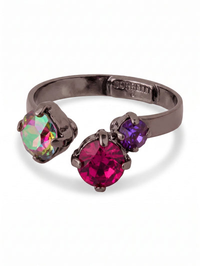 Bubbles Adjustable Open Band Ring - RGK3GMNNI - <p>Three distinctly colored round crystals orbit the open space of this dark metal band. On one side, an iridescent stone shifts between green and pink as your hands move through the day. Opposite it, two rich fuchsia and burgundy crystals add a saturated weight to the design. The open band structure allows you to gently squeeze or expand the metal for a customized fit, making it effortless to swap between fingers. It brings a modern asymmetry to your daily ring stack.</p><ul>
<li>Asymmetrical open face design with an interplay of solid and color-shifting crystals</li>
<li>Adjustable ring band</li>
<li>Includes signature organza pouch for gifting and travel</li>
</ul>
