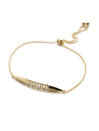 Halcyon Cursory Crystal Slider Bracelet - 4BEK28BGCRY - Slip on some edge with this adjustable bracelet featuring a pointed metal statement piece and a foursome of beautiful baguette crystals. From Sorrelli's Crystal collection in our Bright Gold-tone finish.
