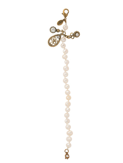 Mika Tennis Bracelet - 4BET7AGMDP - <p>The Mika Tennis Bracelet features a line of freshwater pearls and 3 cute metal and crystal charms. Secure the bracelet with a lobster claw clasp. From Sorrelli's Modern Pearl collection in our Antique Gold-tone finish.</p>