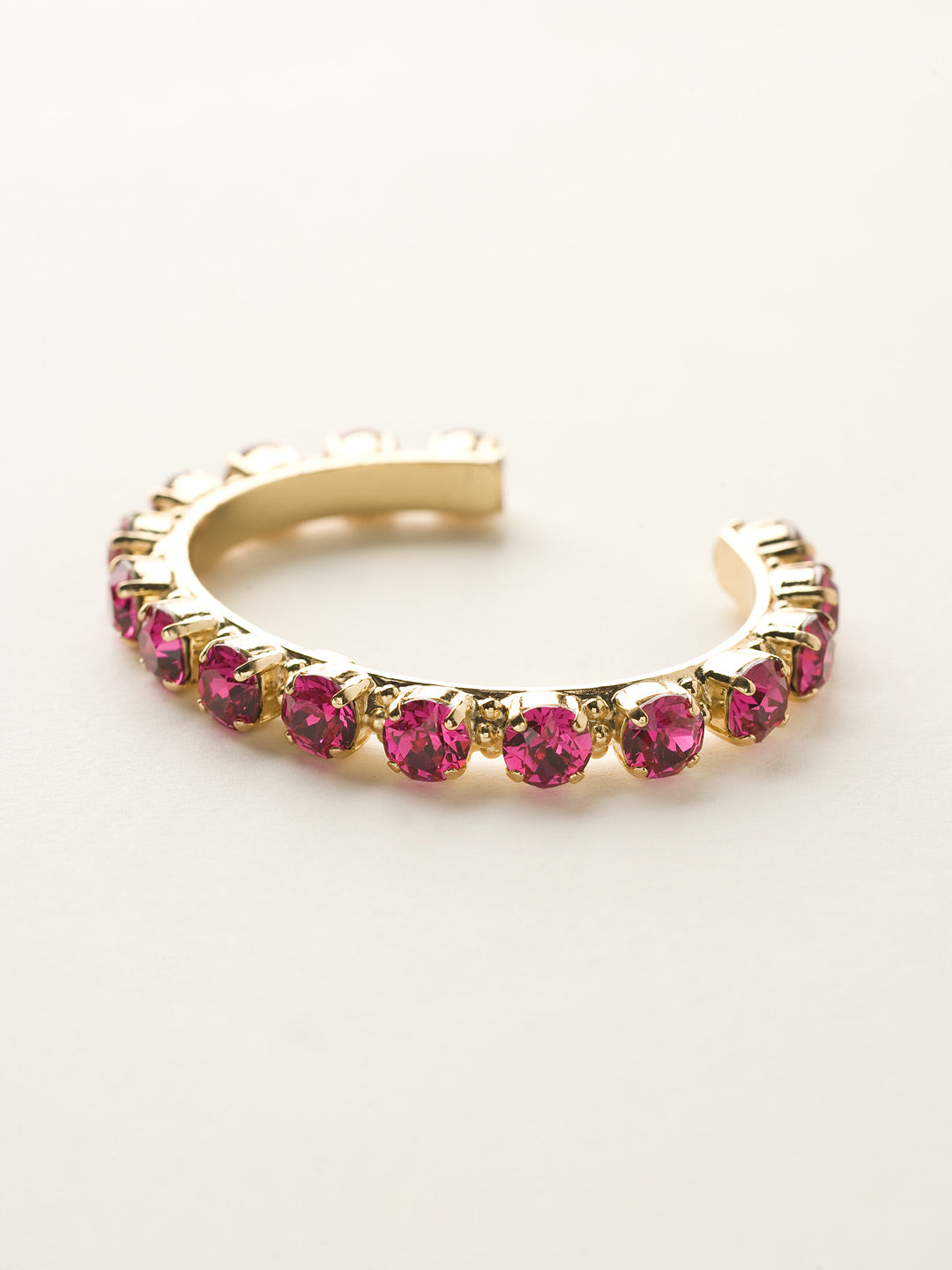 Riveting Romance Cuff Bracelet - BCL23BGFU - <p>Truly antique-inspired, this piece can be mixed and matched in so many ways. Wear it with a vintage inspired outfit, or add a twist to a modern trend. This piece will match with everything! From Sorrelli's Fuchsia collection in our Bright Gold-tone finish.</p>