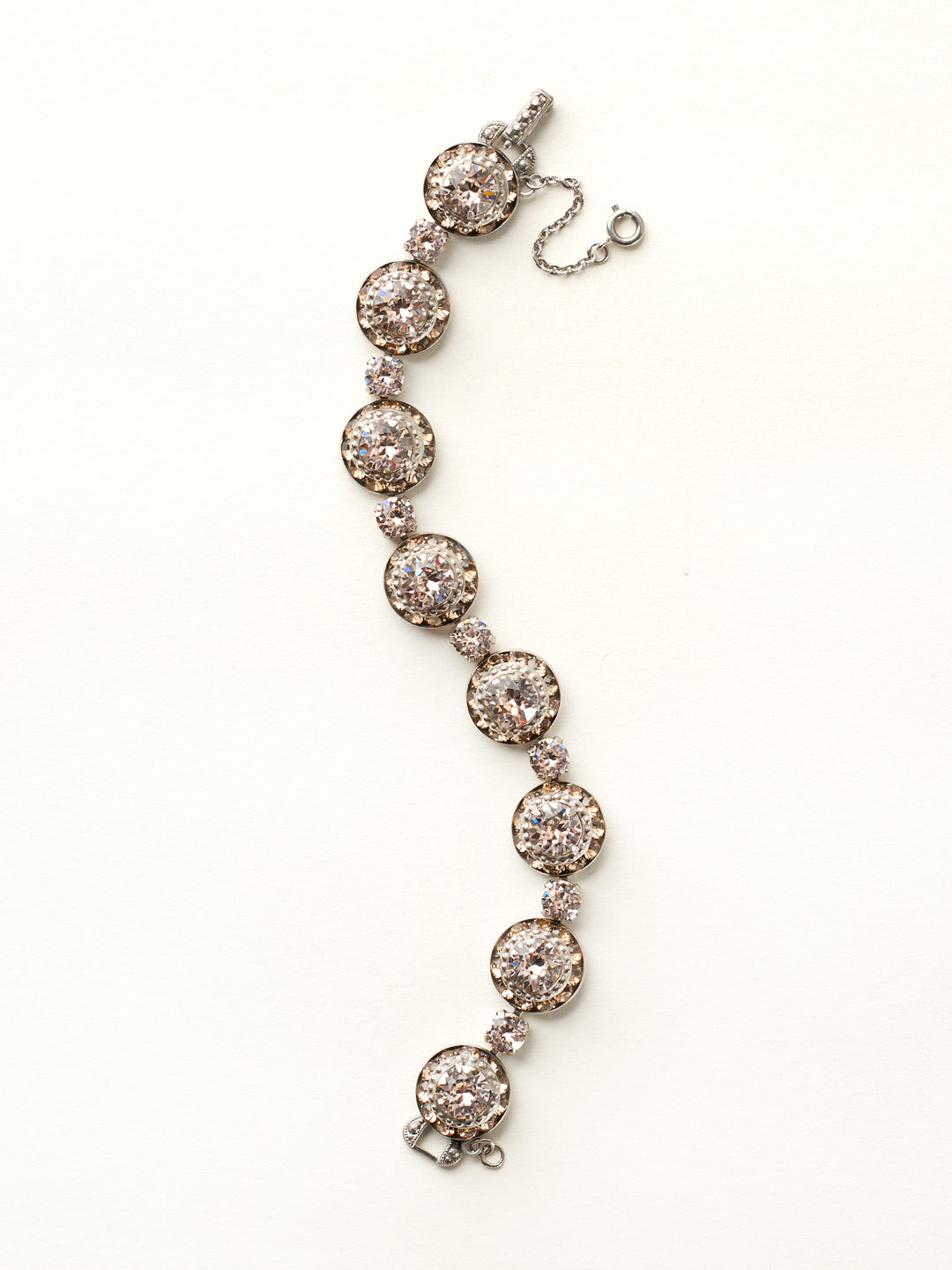 Dynamic Round Setting Line Bracelet - BCZ8ASSBL - Gorgeous and glimmering! This lavish line bracelet features an embellished setting decorated with both large and petite round crystals.