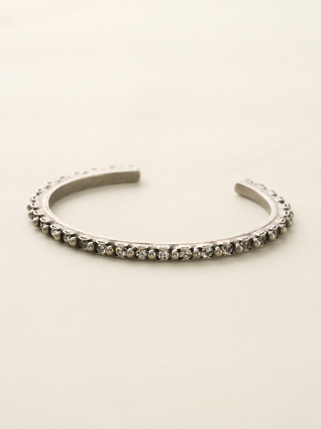 Petite Crystal and Ball Shot Cuff - BDC11ASCRY - The perfect addition to any arm party! With alternating round crystals and metal ball elements, this cuff will have you sparkling all day long.