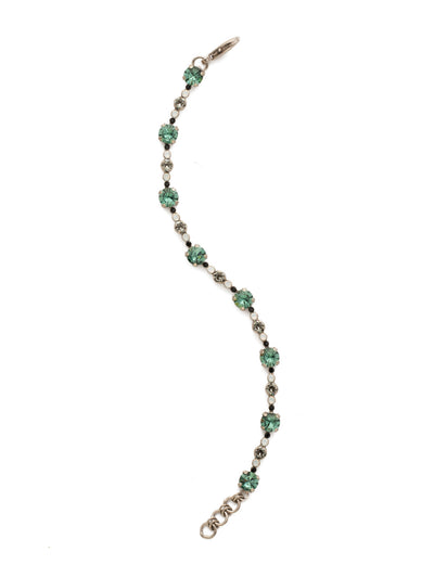 Connect the Dots Bracelet - BDN15ASGDG - <p>Eight large round cut crystals are connected by petite circular stones in this eye-catching style. Layer it with other line bracelets for personalized look. From Sorrelli's Game Day Green collection in our Antique Silver-tone finish.</p>