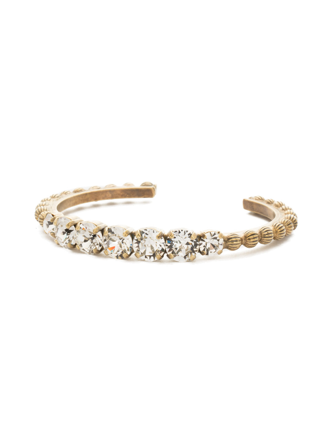 Mimosa Cuff Bracelet - BDQ24AGCRY - <p>A stylish cuff bracelet with far-away flare! Decorative ball chain accents this adjustable cuff featuring round and oval cut crystals. From Sorrelli's Crystal collection in our Antique Gold-tone finish.</p>