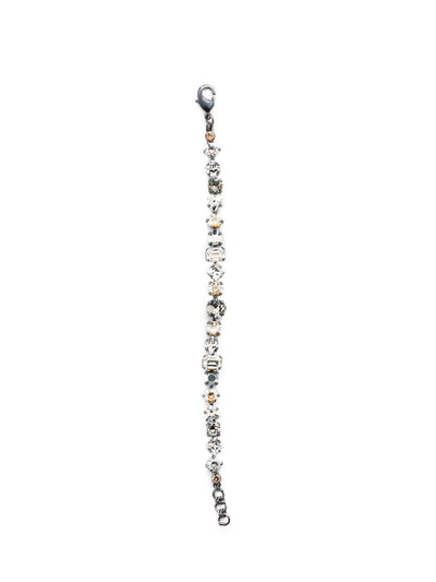 Sedge Tennis Bracelet - BDX1GMGNS - This fully encrusted line bracelet features a variety of stones in square, round, cushion antique, triangle antique, and baguette shapes. From Sorrelli's Golden Shadow collection in our Gun Metal finish.