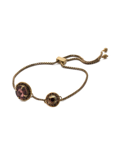 Dua Slider Bracelet - BEA25AGMMA - Sparkling halo crystals connect on a delicate adjustable slider chain. From Sorrelli's Mighty Maroon collection in our Antique Gold-tone finish.