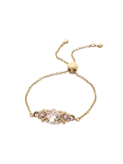 Rosina Slider Bracelet - BEA30AGBCM - Perfect for any occasion, our Rosina classic bracelet features a variety of different sized circular crystals nestled in a detailed center piece, with an adjustable chain completing this unique piece. From Sorrelli's Beach Comber collection in our Antique Gold-tone finish.