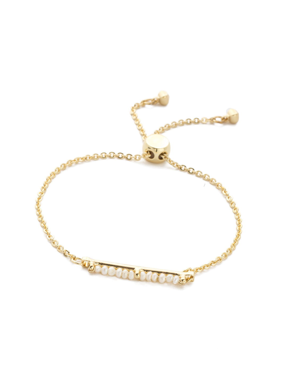 Elena Slider Bracelet Slider Bracelet - BEC12BGPLP - <p>Dainty and elegant! This slider bracelet features a row of petite pearl beads at its center and is all held together by an adjustable delicate chain. From Sorrelli's Polished Pearl collection in our Bright Gold-tone finish.</p>