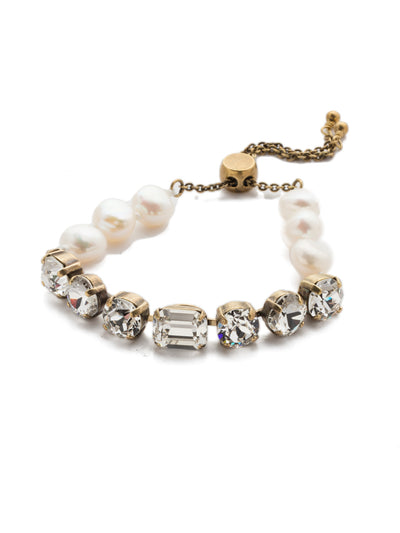Cadenza Slider Bracelet - BEC14AGCRY - <p>A classic line bracelet reimagined with a adjustable slider clasp. A pattern of crystals and pearls give this bracelet all around allure. From Sorrelli's Crystal collection in our Antique Gold-tone finish.</p>