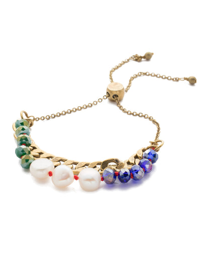 Brienne Slider Bracelet - BEF42AGGOT - <p>A combination of pearls and beads sitting atop a metal band. Dainty in appearance this slider is perfect for a night on the town and can easily be dressed up or down. It can also be easily adjusted to create your own ideal fit. From Sorrelli's Game of Jewel Tones collection in our Antique Gold-tone finish.</p>