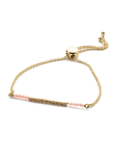 Bilss Slider Bracelet - BEH21BGISS - <p>Slide on this adjustable beauty featuring a row of crystal gems accented by beadwork on each side. Slider bracelet closure. From Sorrelli's Island Sun collection in our Bright Gold-tone finish.</p>