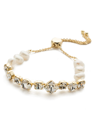 Carwyn Slider Bracelet - BEK18BGMDP - This splash of assorted crystal stones paired with freshwater pearls oozes romance. Slip it on for a night out with that someone special. From Sorrelli's Modern Pearl collection in our Bright Gold-tone finish.