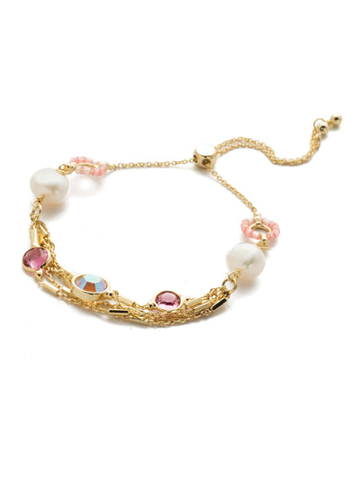 Luminous Slider Bracelet - BEK2BGISS - Slide this beauty on and you're already layered in style featuring crystals, delicate metallic accents, and even freshwater pearls. Perfection. Slider bracelet closure. From Sorrelli's Island Sun collection in our Bright Gold-tone finish.