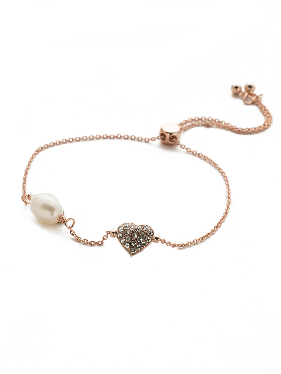 Pippa Slider Bracelet - BEM6RGCRY - <p>A crystal heart, sparking stones, a freshwater pearl, what more could a girl want around her wrist? This one is the way to her - or your - heart. (Ladies, it's okay - treat yourself!) From Sorrelli's Crystal collection in our Rose Gold-tone finish.</p>