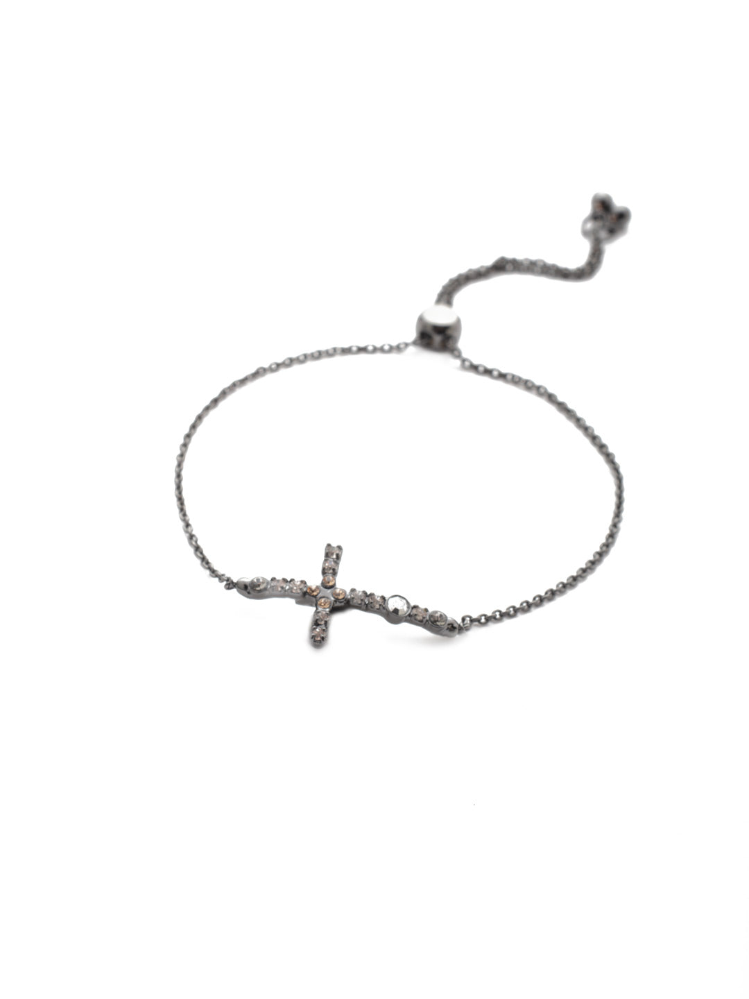 Giovanna Slider Bracelet - BEN1GMGNS - The Giovanna Slider Bracelet features the crystal-encrusted cross fans are looking to slip on. Just adjust to your wrist size and you're set. From Sorrelli's Golden Shadow collection in our Gun Metal finish.