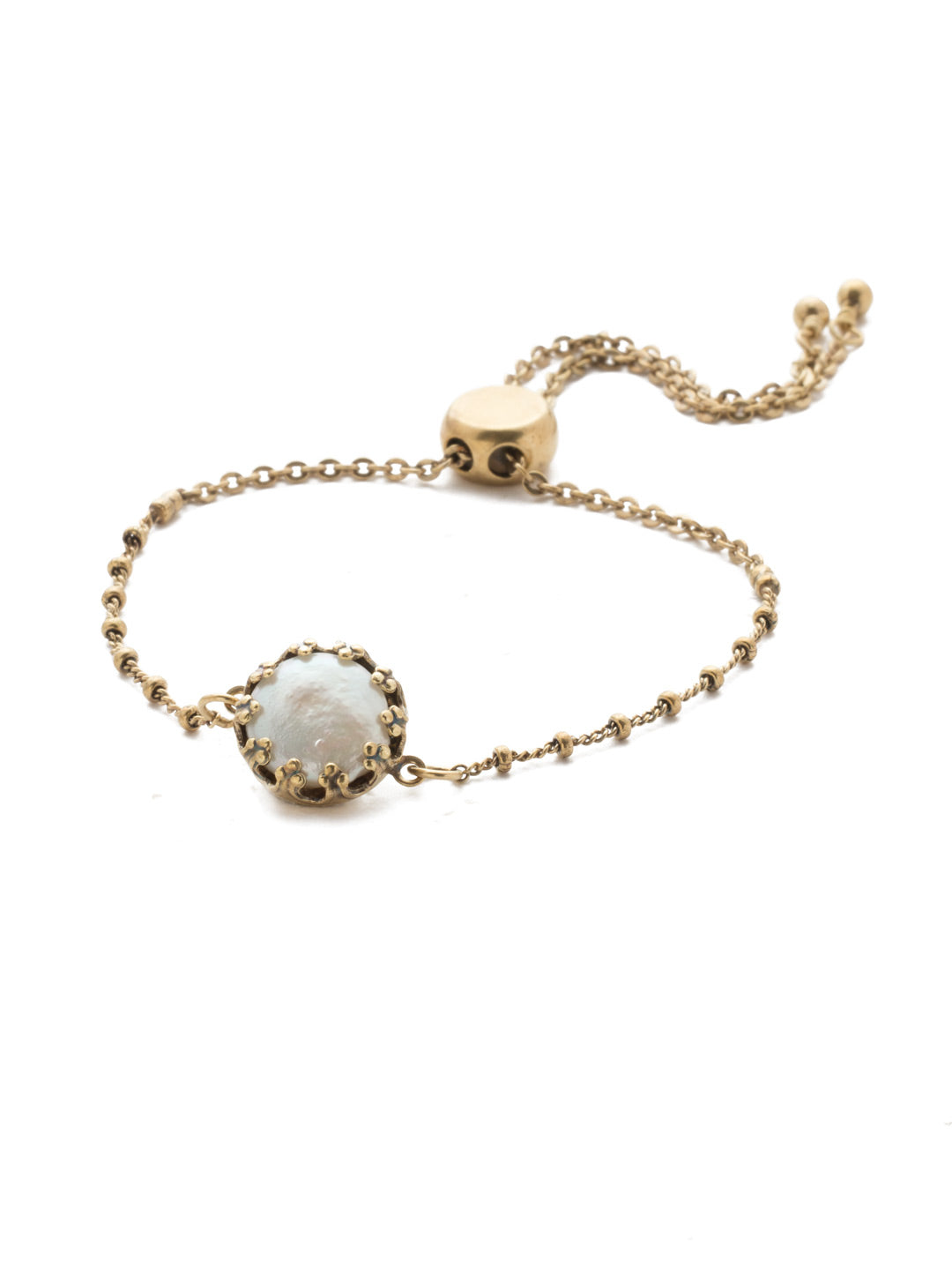 Delaney Slider Bracelet - BEN35AGIRB - <p>The Delaney Slider Bracelet is a classic. Anchored by an exquisite freshwater pearl, and paired with delicate metal detail, it's a stand-out everyone will love. From Sorrelli's Iris Bloom collection in our Antique Gold-tone finish.</p>