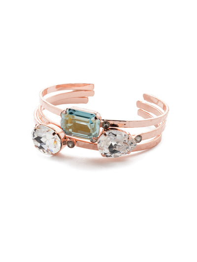 Leslie Cuff Bracelet - BEP18RGCAZ - Make a statement with the Leslie Cuff Bracelet. Tonal sparkling crystal in pear, oval and cushion octagon shapes showcase a variety of shades on a shining three-tier metal band. From Sorrelli's Crystal Azure collection in our Rose Gold-tone finish.