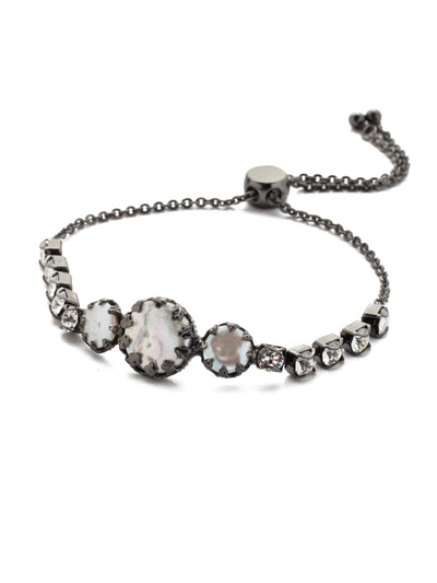 Katarina Slider Bracelet - BEP2GMMMO - <p>The Katarina Slider Bracelet showcases classically round, sparkling crystals surrounding a trio of interesting opaque stones sure to turn heads. From Sorrelli's Midnight Moon collection in our Gun Metal finish.</p>