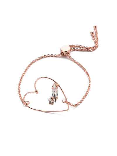 Love Slider Bracelet - BER1RGCRY - <p>Slip on the Love Slider Bracelet and look out. Everyone who loves love will want one of their own. The open-air metal heart shines bright with an affixed navette and oval sparkling crystal. From Sorrelli's Crystal collection in our Rose Gold-tone finish.</p>