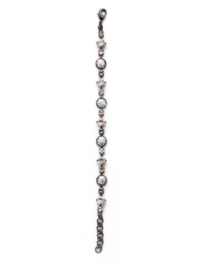 Emmanuella Tennis Bracelet - BES12GMGNS - Our Emmanuella Tennis Bracelet is proof positive that beautiful things can come in small packages. Fasten on this classic piece featuring sparkling crystals and freshwater pearls. From Sorrelli's Golden Shadow collection in our Gun Metal finish.
