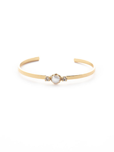 Kit Cuff Bracelet - BEV106BGCRY - <p>The Kit Cuff Bracelet features a single freshwater pearl nestled between two crystals on an adjustable cuff band. The dainty design makes it perfect for layering! From Sorrelli's Crystal collection in our Bright Gold-tone finish.</p>