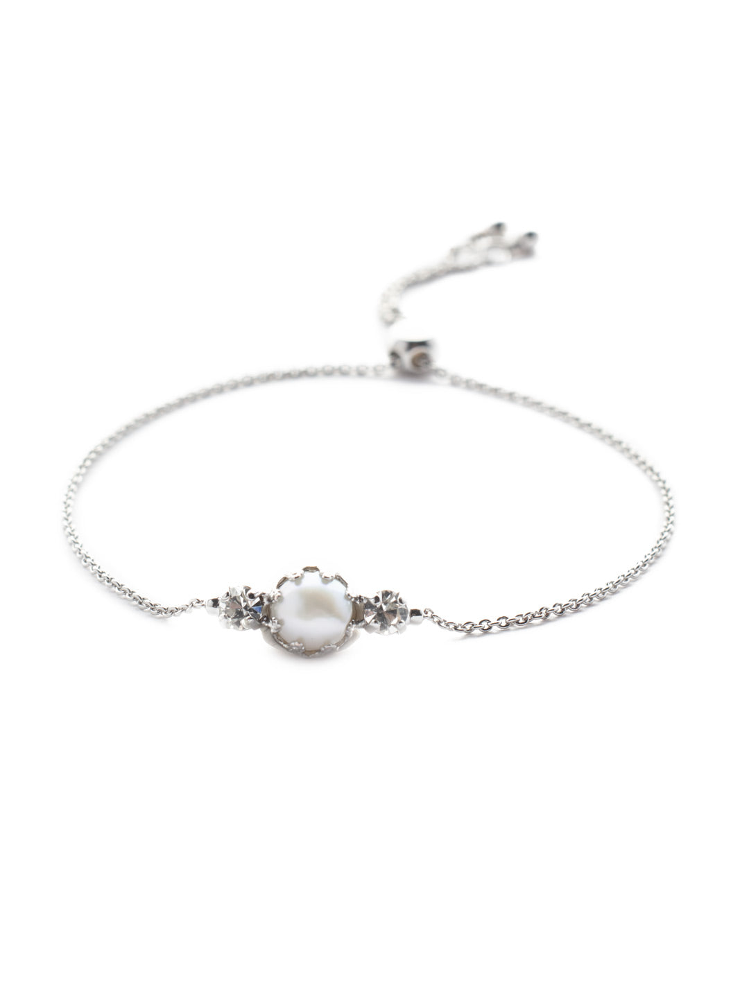 Kit Slider Bracelet - BEV166PDCRY - The Kit Slider Bracelet features a single freshwater pearl nestled between two crystals on an adjustable slider chain. The dainty design makes it perfect for layering! From Sorrelli's Crystal collection in our Palladium finish.