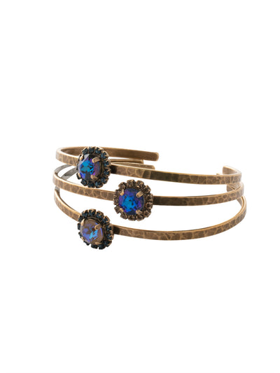 Haute Halo Stacked Bracelet - BEY10AGVBN - <p>Create a trendy stacked look with the Haute Halo Stacked Bracelet set. A single halo set round crystal sits atop of each adjustable bangle cuff. From Sorrelli's Venice Blue collection in our Antique Gold-tone finish.</p>