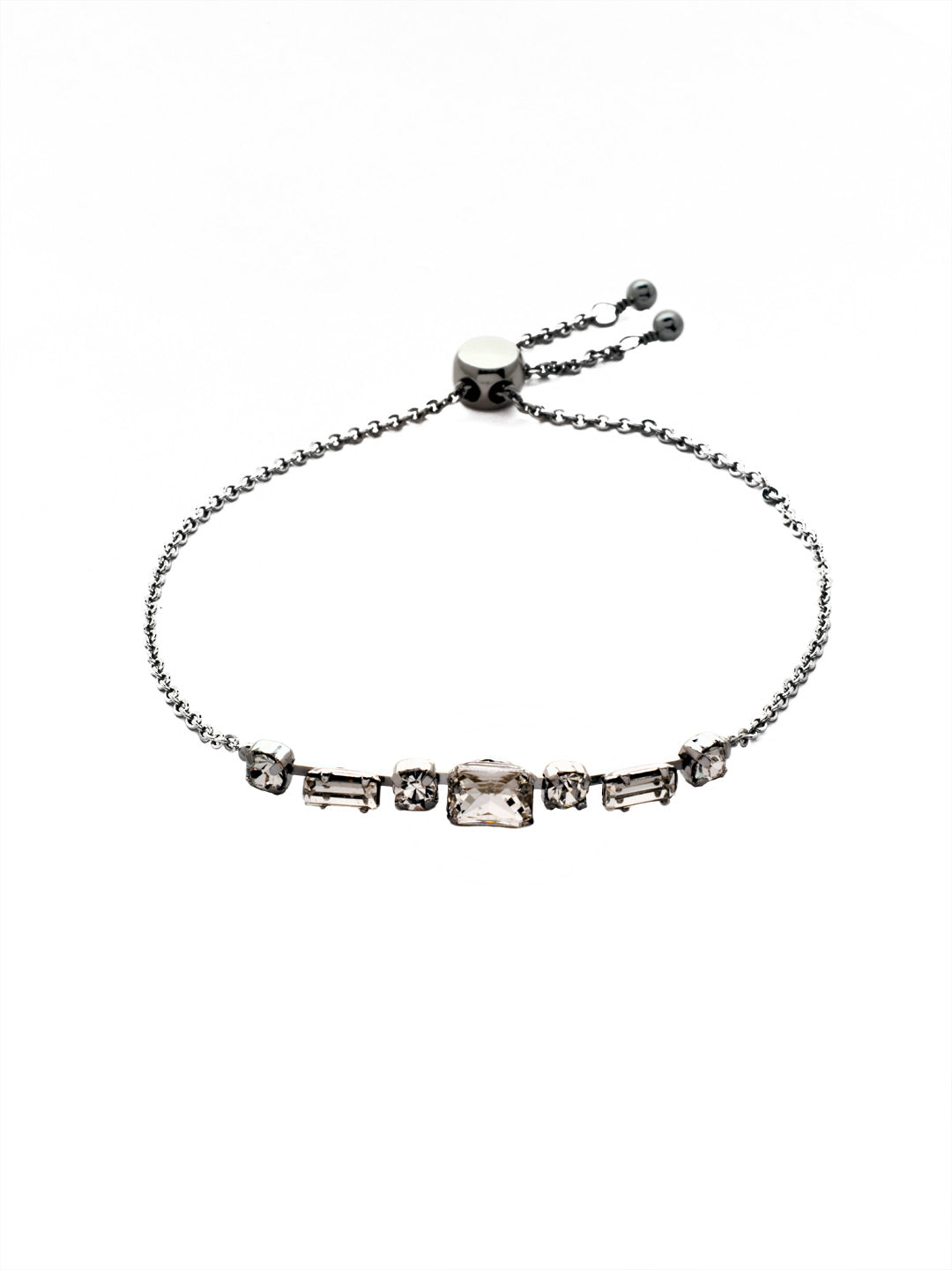 Scilla Slider Bracelet - BEZ13PDCRY - <p>The Scilla Slider Bracelet features an assortment of round, octagon, and baguette cut crystals lined halfway around a chain, secured with an adjustable slider . From Sorrelli's Crystal collection in our Palladium finish.</p>