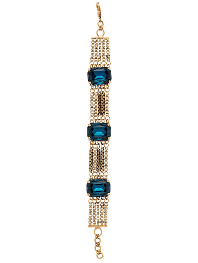 Brynn Studded Tennis Bracelet - BFC22AGVBN - <p>The Brynn Studded Tennis Bracelet features three emerald cut crystals nestled between rows of box chains, secured with a lobster claw clasp. From Sorrelli's Venice Blue collection in our Antique Gold-tone finish.</p>