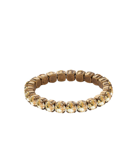 7 inch Sienna Stretch Bracelet - BFD50AGCCH - <p>A modern take on a classic style, the Sienna Stretch Bracelet features a line of crystals on a sturdy jewelers' filament, stretching to fit most wrists comfortably, without the hassle of a clasp! (7 inches in diameter, fits average wrist sizes) From Sorrelli's Crystal Champagne collection in our Antique Gold-tone finish.</p>