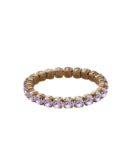 7 inch Sienna Stretch Bracelet - BFD50AGVI - <p>A modern take on a classic style, the Sienna Stretch Bracelet features a line of crystals on a sturdy jewelers' filament, stretching to fit most wrists comfortably, without the hassle of a clasp! (7 inches in diameter, fits average wrist sizes) From Sorrelli's Violet collection in our Antique Gold-tone finish.</p>