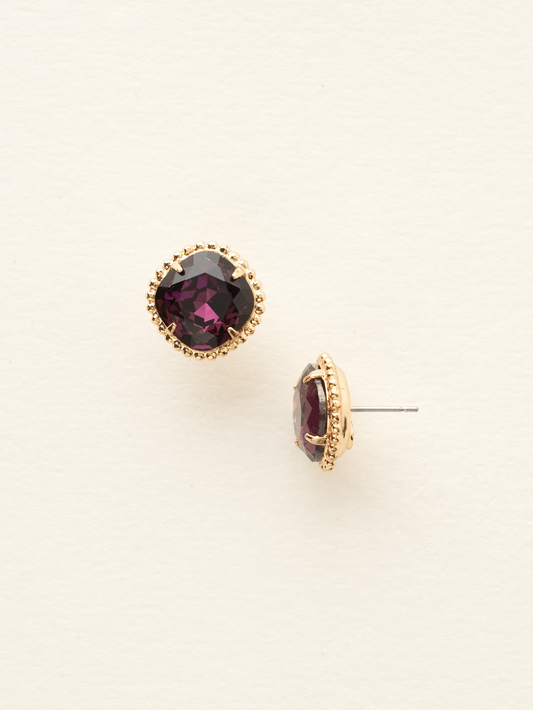 Cushion-Cut Solitaire Stud Earrings - EBX10BGAM - <p>All around allure; the Cushion-Cut Solitaire Stud Earring features a rounded-edge, cushion cut stone that is encircled by a vintage inspired decorative, edged border. A post backing ensures comfortable, everyday wear. From Sorrelli's Amethyst collection in our Bright Gold-tone finish.</p>