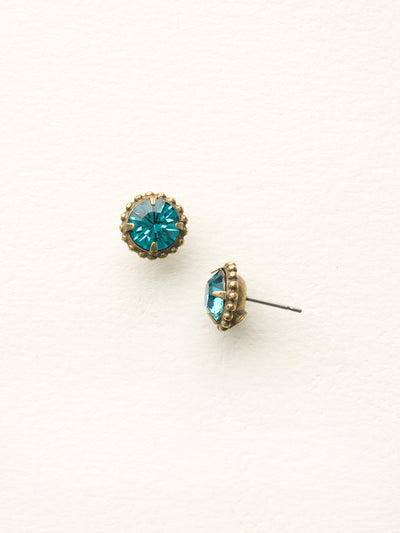 Simplicity Stud Earrings - EBY38AGBLU - <p>A timeless classic, the Simplicity Stud Earrings feature round cut crystals in a variety of colors; accented with a halo of metal beaded detail. Need help picking a stud? <a href="https://www.sorrelli.com/blogs/sisterhood/round-stud-earrings-101-a-rundown-of-sizes-styles-and-sparkle">Check out our size guide!</a> From Sorrelli's Blue Topaz collection in our Antique Gold-tone finish.</p>